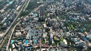 PD0322 - Aerial View of Urban Contrast in Mumbai: Slums Alongside Skyscrapers