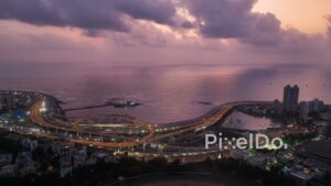 PD0371 - Cinematic Twilight Aerial of Mumbai's Illuminated Coastal Road Interchange