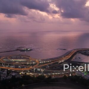 PD0371 - Cinematic Twilight Aerial of Mumbai's Illuminated Coastal Road Interchange