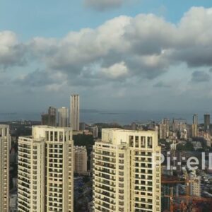 PD0369 - Majestic Aerial Rise Past Mumbai Skyscrapers Revealing the Cityscape and Sea