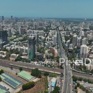 PD0361 - Aerial Drone Flight Over Mumbai's Suburban Railway and Flyover