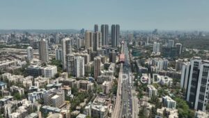 PD0359 - Aerial Flyover of Mumbai's Western Express Highway and Metro Line