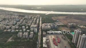 PD0357 - Aerial Flyover of a Mumbai Suburb Bordering a Mangrove Creek