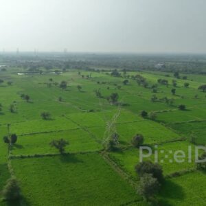 PD0403 - Aerial View of Electrical Power Lines Crossing a Lush Green Agricultural Landscape