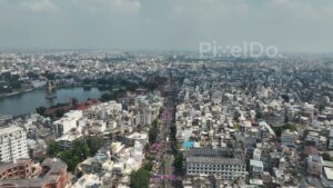 PD0393 - Aerial Flyover of Vadodara Cityscape with Sursagar Lake and Palace Road, India