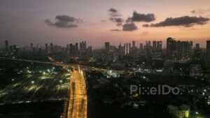 PD0389 - Mumbai at Twilight: Aerial View of the Illuminated Atal Setu Sea Link