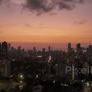 PD0388 - Twilight Glow Over Mumbai Skyline with Illuminated City Lights, Aerial View