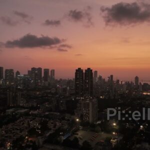 PD0387 - Twilight Glow Over Mumbai Skyline with Illuminated City Lights, Aerial View