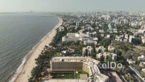 PD0499 - Mumbai's Urban Coast: Aerial View of Juhu Beach and Hotels