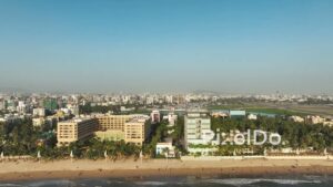 PD0484 - Aerial Pan of Mumbai's Famous Juhu Beach at Sunset