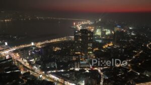 PD0483 - Mumbai's Electric Glow: Night Orbit Over the Bandra Coastline