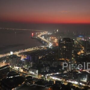 PD0482 - Mumbai City Lights: Aerial Pan of Bandra Coastline at Dusk