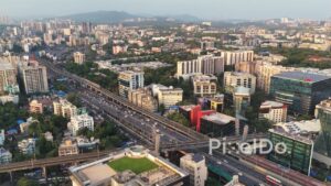 PD0471 - Golden Hour Aerial View of a Bustling Urban Expressway and Metro System