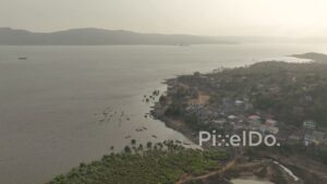 PD0519 - Scenic Aerial View of a Coastal Fishing Village at Sunrise