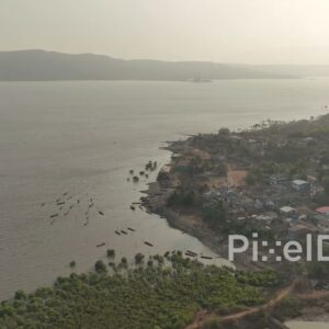 PD0519 - Scenic Aerial View of a Coastal Fishing Village at Sunrise