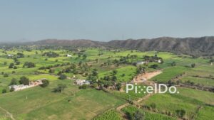 PD0779 - Aerial Flight Over Rajasthan's Green Farmlands