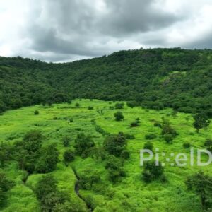 PD0765 - Cinematic Aerial Pan Across a Lush Green Mountain Valley