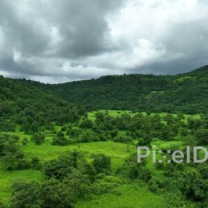 PD0763 - Scenic Aerial Flight Over a Lush Green Mountain Valley