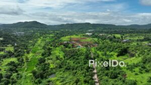 PD0762 - Aerial Drone View of Construction in a Green Valley