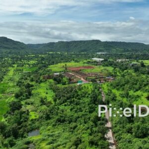 PD0762 - Aerial Drone View of Construction in a Green Valley