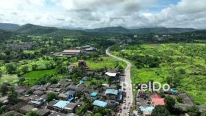 PD0759 - Aerial Drone Flight Over a Rural Village in a Lush Green Valley