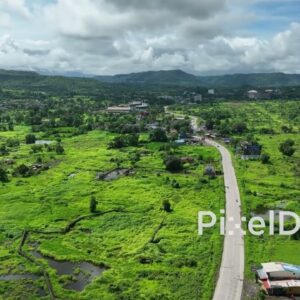 PD0758 - Aerial Drone Shot of a Scenic Road Through a Lush Green Countryside