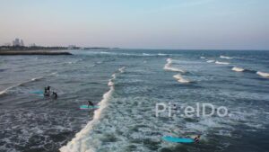 PD0894 - Aerial View of People Surfing and Paddleboarding
