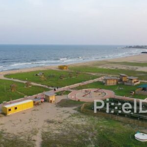 PD0897 - Aerial Orbit of a Scenic Beach Park at Sunset