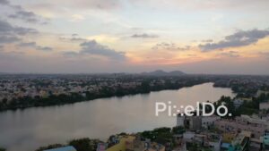PD0887 - Scenic Aerial View of a Riverside City at Sunset