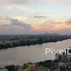 PD0887 - Scenic Aerial View of a Riverside City at Sunset