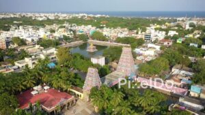 PD0884 - Aerial Orbit of a Colorful Coastal Temple Complex