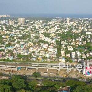 PD0880 - Aerial View of Chennai's Coastal Cityscape with Urban Art and Train