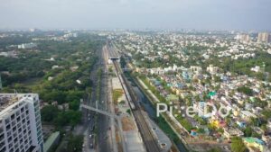 PD0878 - Aerial View of Chennai's Coastal Development and Railway System
