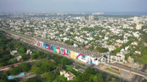 PD0877 - Aerial View of Vibrant Urban Mural Along Chennai's Coastline