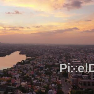 PD0927 - Aerial Pan of a Riverside City at Sunset