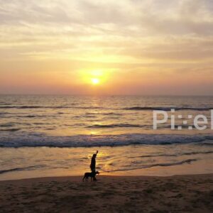 PD0922 - Scenic Aerial View of People Enjoying a Beach Sunrise