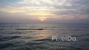 PD0920 - Scenic Aerial Flight Towards the Ocean at Sunrise