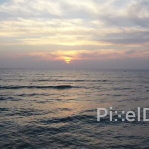 PD0920 - Scenic Aerial Flight Towards the Ocean at Sunrise