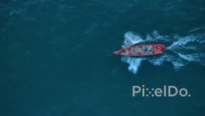 PD0913 - Top-Down Aerial Tracking Shot of a Fishing Boat at Sea