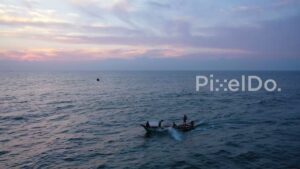 PD0911 - Aerial Tracking Shot of Fishermen Heading Out at Sunrise