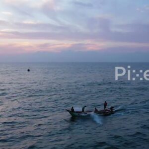 PD0911 - Aerial Tracking Shot of Fishermen Heading Out at Sunrise
