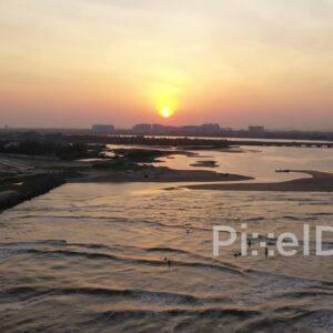 PD0905 - Panoramic Aerial Sunset over a Coastal City and Jetty