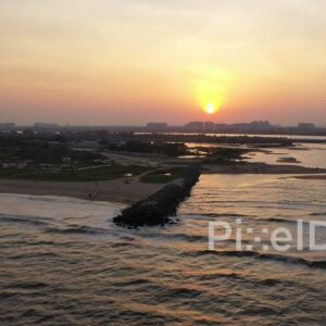 PD0904 - Stunning Aerial Pullback of a Jetty at Sunset