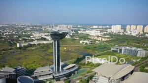 PD0959 - Aerial Drone Orbits a Futuristic Tower and Modern Corporate Park