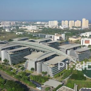 PD0954 - Aerial Pan of Modern Technology Park and Cityscape