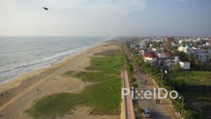 PD0945 - Drone View of Morning Walkers Along Chennai's Scenic Coastline