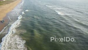 PD0942 - Drone Captures Fishermen's Teamwork on a Coastal Beach