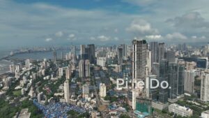 PD0993 - Slow Aerial Pan Revealing the Urban Contrast of a Coastal Metropolis