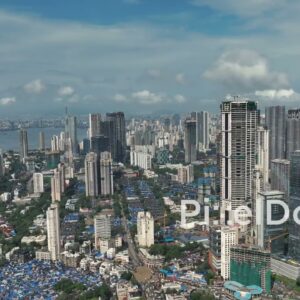 PD0993 - Slow Aerial Pan Revealing the Urban Contrast of a Coastal Metropolis