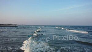PD0977 - Aerial Drone View of a Surf Lesson in the Ocean